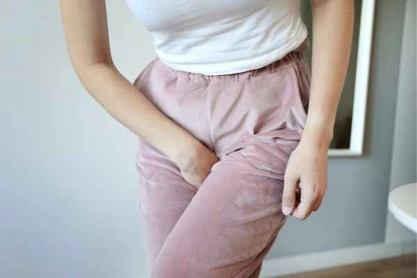 woman struggling with urine incontinence Llanelli
